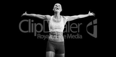 Fit woman celebrating victory with arms stretched