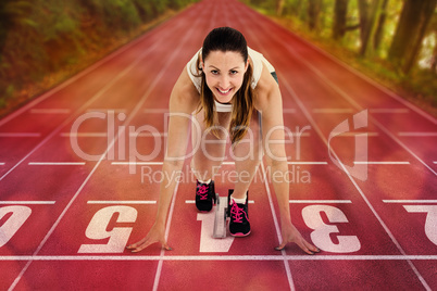 Composite image of athlete woman in ready to run position