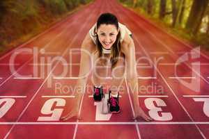 Composite image of athlete woman in ready to run position