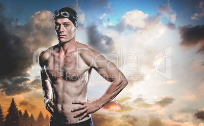 Composite image of swimmer standing with hand on hip