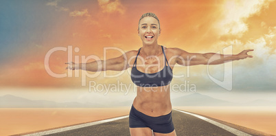 Composite image of female athlete raising arms