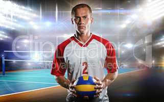 Composite image of sportsman holding a volleyball