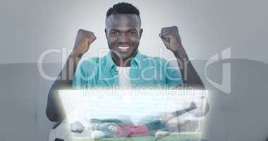 Composite image of happy man are watching sport on television