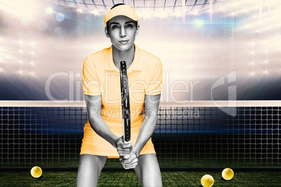 Composite image of female athlete waiting a tennis ball