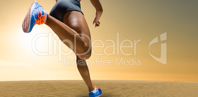 Composite image of sporty woman finishing her run