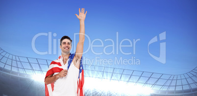 Athlete with american flag wrapped around his body