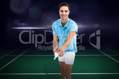 Composite image of badminton player holding a racket ready to se