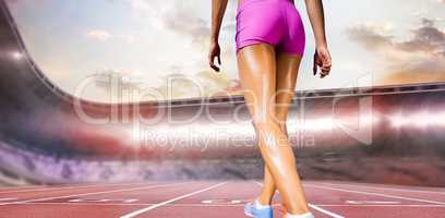 Composite image of rear view of sportswoman legs with sweat