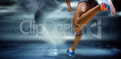 Composite image of sporty woman finishing her run