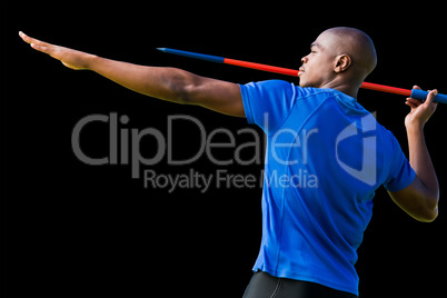 Composite image of profile view of sportsman practising javelin