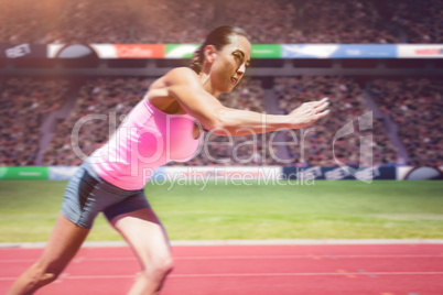 Composite image of an athletic woman starting to run