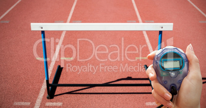 Close up of woman is holding a stopwatch