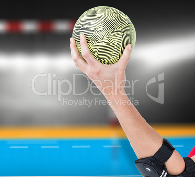 Composite image of female athlete with elbow pad holding handbal