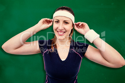 Composite image of female athlete wearing headband and wristband