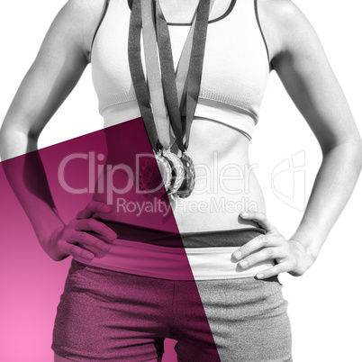 Composite image of portrait of sporty woman chest holding medals