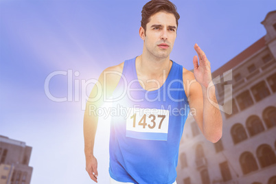 Composite image of male athlete running on white background