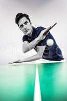 Composite image of confident male athlete playing table tennis