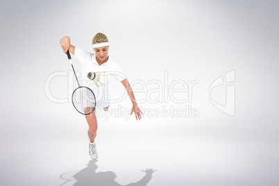 Composite image of badminton player playing badminton