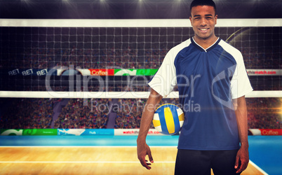 Composite image of sportsman holding a volleyball