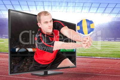 Composite image of sportsman posing while playing volleyball