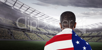 Athlete with american flag wrapped around his body