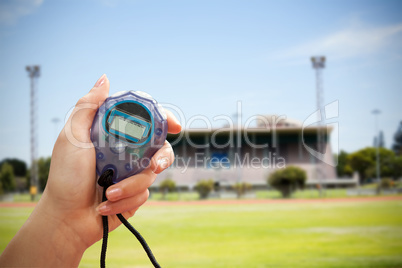 Close up of a hand holding a stopwatch