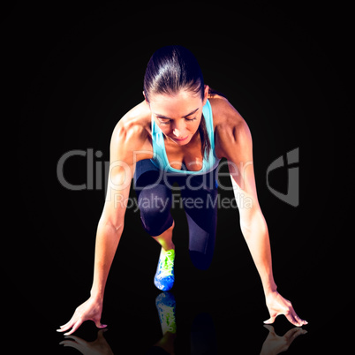 Composite image of sportswoman in the starting block