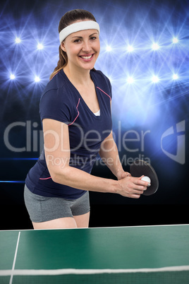 Composite image of female athlete posing while playing ping pong