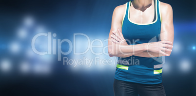 Composite image of sportswoman posing and smiling on a white bac