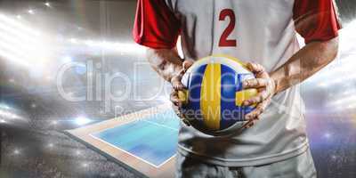 Composite image of sportsman holding a volleyball