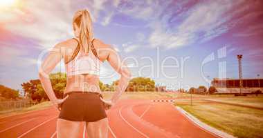 Female athlete posing with hands on hip