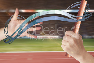 Athlete passing a baton to the partner