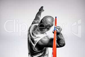 Composite image of rear view of athlete preparing to throw javel