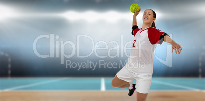 Composite image of sportswoman throwing a ball