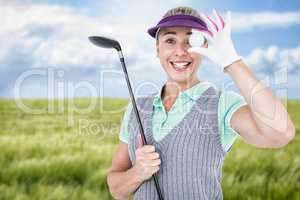 Composite image of pretty blonde playing golf