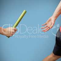 Composite image of athlete passing a baton to the partner