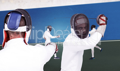 Composite image of man wearing fencing suit practicing with swor