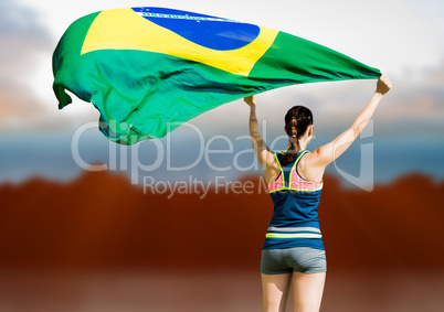 Composite image of rear view of sportswoman raising a brazilian