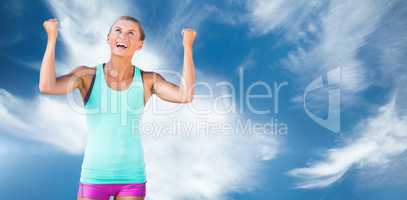 Athletic woman with arms up