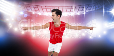Composite image of excited male athlete with arms outstretched