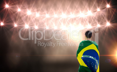 Rear view of Brazilian sportsman against flash light