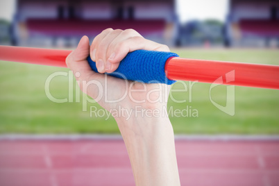 Composite image of female athlete throwing a javelin