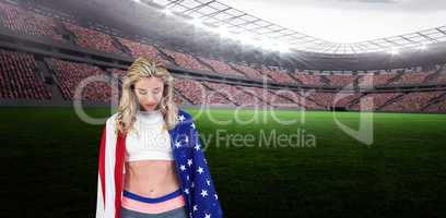 Athlete with american flag wrapped around her body