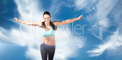 Composite image of happy sportswoman is raising arms