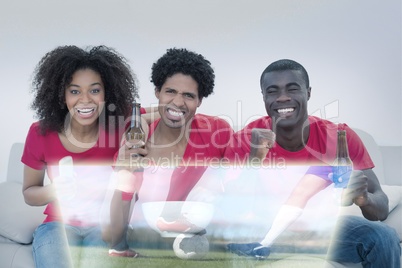 Composite image of friends are watching sport on television with