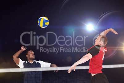 Composite image of sportsman hitting volleyball