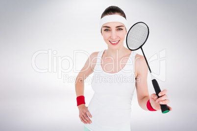 Composite image of badminton player is posing and smiling