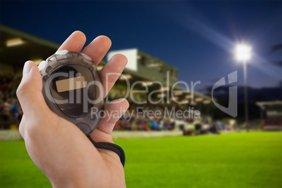 Close up of hand holding a stopwatch