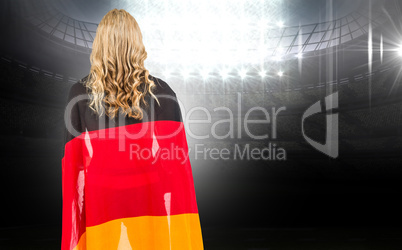 Composite image of athlete with german flag wrapped around his b