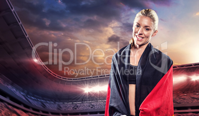 Athlete posing with german wrapped around her body